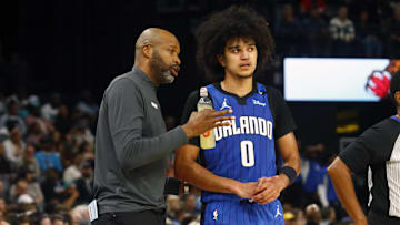 Orlando Magic head coach Jamahl Mosley talks with guard Anthony Black (0) during the first half against the Memphis Grizzlies at FedExForum.