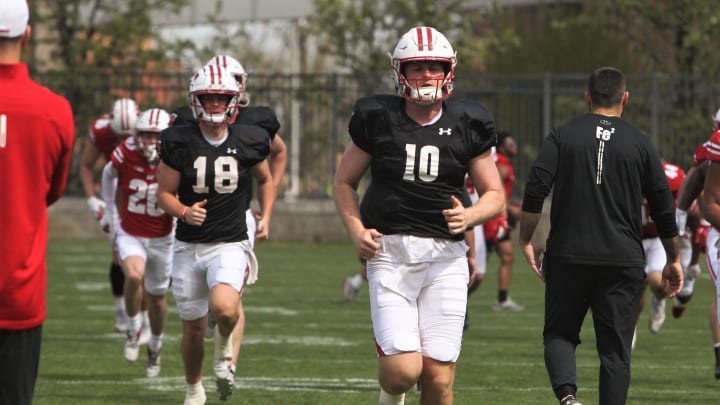 Wisconsin quarterbacks Tyler Van Dyke (10) and Braedyn Locke (18) warm up on the field north of Camp Randall Stadium in Madison, Wisconsin on Saturday April 27, 2024 before the team's intrasquad scrimmage. © Mark Stewart / Milwaukee Journal Sentinel / USA TODAY NETWORK