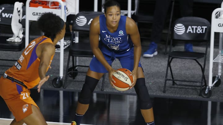 Sep 17, 2020; Bradenton, Florida, USA; Minnesota Lynx forward Napheesa Collier (24) looks to pass beyond Phoenix Mercury forward Brianna Turner (21) during the first half at the FELD Entertainment complex. Mandatory Credit: Reinhold Matay-Imagn Images