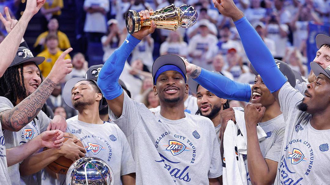 May 28, 2025; Oklahoma City, Oklahoma, USA; Oklahoma City Thunder guard Shai Gilgeous-Alexander holds up the MVP trophy for the western conference finals for the 2025 NBA Playoffs at Paycom Center. Mandatory Credit: Alonzo Adams-Imagn Images