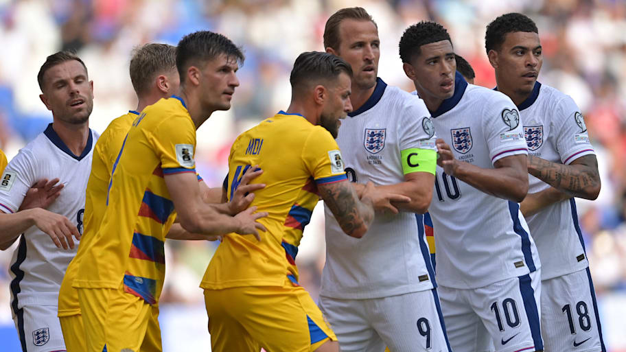 England and Andorra players jostling.