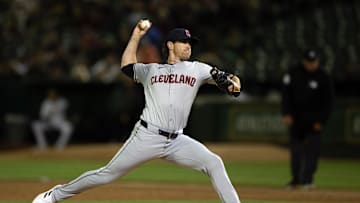 Mar 28, 2024; Oakland, California, USA; Cleveland Guardians starting pitcher Shane Bieber (57) delivers a pitch against the Oakland Athletics during the third inning at Oakland-Alameda County Coliseum. 