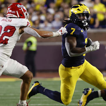 Aug 31, 2024; Ann Arbor, Michigan, USA;  Michigan Wolverines running back Donovan Edwards (7) runs the ball against the Fresno State Bulldogs in the first half at Michigan Stadium.