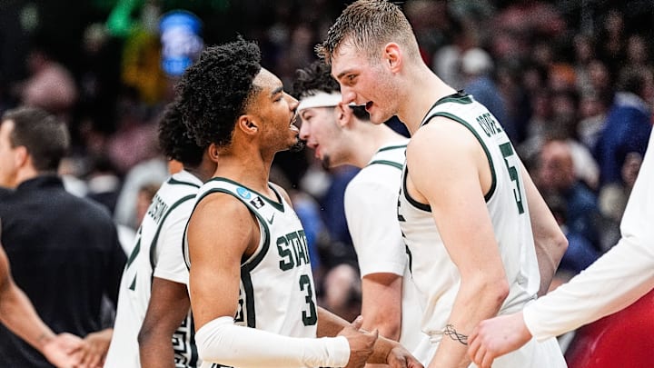 Michigan State guard Jaden Akins (3), left, and center Carson Cooper (15) celebrate 73-70 win over Ole Miss at the Sweet 16 round of NCAA tournament at State Farm Arena in Atlanta, Ga. on Friday, March 28, 2025.