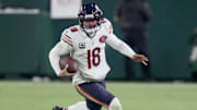 Chicago Bears quarterback Caleb Williams (18) runs for a first down during the third quarter of their game against the Green Bay Packers Sunday, December 7, 2025 at Lambeau Field in Green Bay, Wisconsin.