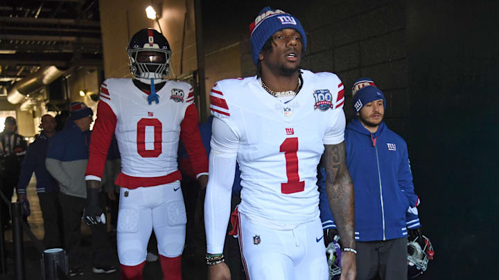 Jan 5, 2025; Philadelphia, Pennsylvania, USA; New York Giants wide receiver Malik Nabers (1) and linebacker Brian Burns (0) take the field against the Philadelphia Eagles at Lincoln Financial Field. Mandatory Credit: Eric Hartline-Imagn Images