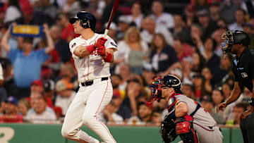 Jun 4, 2024; Boston, Massachusetts, USA; Boston Red Sox right fielder Bobby Dalbec (29) gets a base hit to drive in two runs against the Atlanta Braves in the fourth inning at Fenway Park.