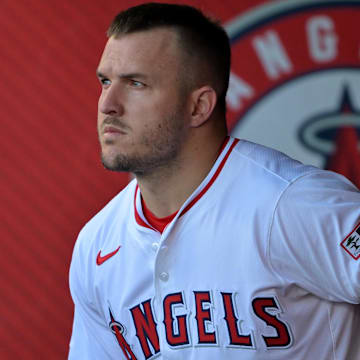 Jul 28, 2025; Anaheim, California, USA;  Los Angeles Angels designated hitter Mike Trout (27) looks on from the dugout during the game against the Texas Rangers at Angel Stadium. Mandatory Credit: Jayne Kamin-Oncea-Imagn Images