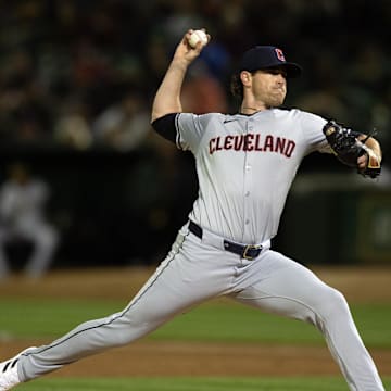 Mar 28, 2024; Oakland, California, USA; Cleveland Guardians starting pitcher Shane Bieber (57) delivers a pitch against the Oakland Athletics during the third inning at Oakland-Alameda County Coliseum. 