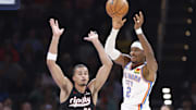 Nov 20, 2024; Oklahoma City, Oklahoma, USA; Oklahoma City Thunder guard Shai Gilgeous-Alexander (2) passes in front of Portland Trail Blazers forward Toumani Camara (33) during the second quarter at Paycom Center. Mandatory Credit: Alonzo Adams-Imagn Images