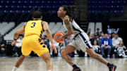 Penn State Nittany Lions guard Ace Baldwin Jr. dribbles the ball against Coppin State at the Bryce Jordan Center. 