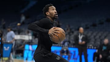 Apr 4, 2025; Charlotte, North Carolina, USA; Sacramento Kings guard Malik Monk (0) shoots during pregame warm ups against the Charlotte Hornets at Spectrum Center. Mandatory Credit: Jim Dedmon-Imagn Images