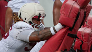 July 30, 2025; Tuscaloosa, AL, USA; Defensive lineman Tim Keenan III hit the sled during the first practice session of the preseason for the Alabama Crimson Tide.