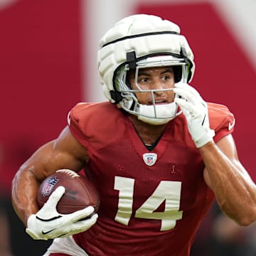 Arizona Cardinals receiver Michael Wilson (14) runs with the ball during training camp at State Farm Stadium on Aug 6, 2024, in Glendale, Ariz.