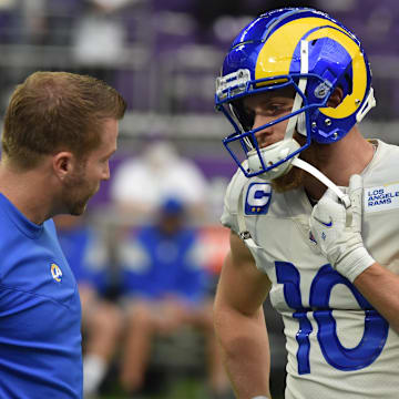 Dec 26, 2021; Minneapolis, Minnesota, USA; Los Angeles Rams head coach Sean McVay talks with wide receiver Cooper Kupp (10) before the game against the Minnesota Vikings at U.S. Bank Stadium. Mandatory Credit: Jeffrey Becker-Imagn Images