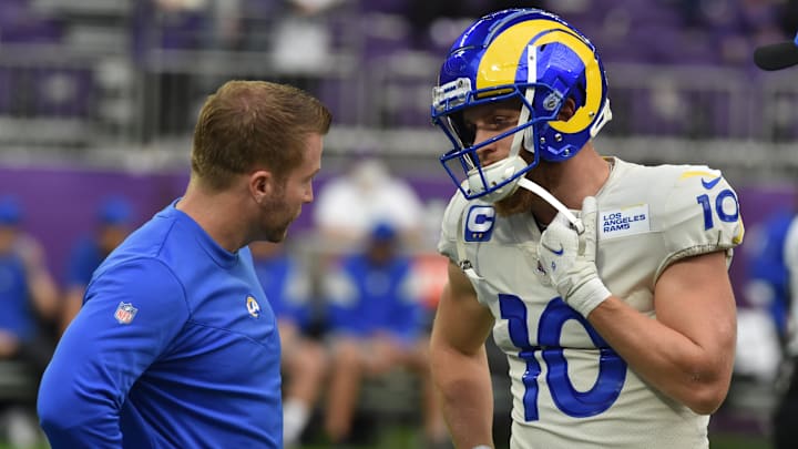 Dec 26, 2021; Minneapolis, Minnesota, USA; Los Angeles Rams head coach Sean McVay talks with wide receiver Cooper Kupp (10) before the game against the Minnesota Vikings at U.S. Bank Stadium. Mandatory Credit: Jeffrey Becker-Imagn Images