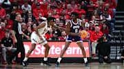 Jan 29, 2025; Lubbock, Texas, USA;  Texas Christian Horned Frogs center Ernest Udeh Jr (8) looks to pass the ball against Texas Tech Red Raiders forward JT Toppin (15) in the first half at United Supermarkets Arena. Mandatory Credit: Michael C. Johnson-Imagn Images