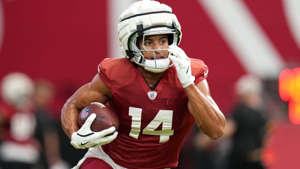 Arizona Cardinals receiver Michael Wilson (14) runs with the ball 