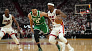 May 23, 2023; Miami, Florida, USA; Miami Heat forward Jimmy Butler (22) controls the ball against Boston Celtics forward Jayson Tatum (0) in the first quarter during game four of the Eastern Conference Finals for the 2023 NBA playoffs at Kaseya Center. Mandatory Credit: Jim Rassol-Imagn Images