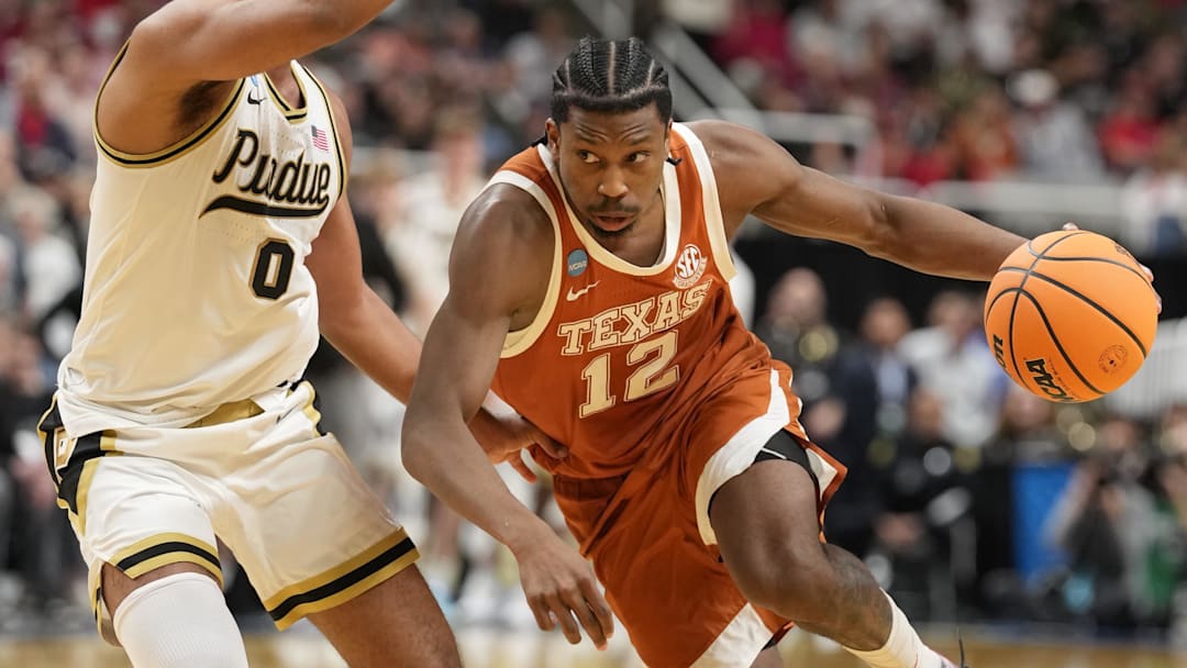 Mar 26, 2026; San Jose, CA, USA; Texas Longhorns guard Tramon Mark (12) goes to the basket against Purdue Boilermakers guard C.J. Cox (0) in the second half during a Sweet Sixteen game of the West Regional of the men's 2026 NCAA Tournament at SAP Center. Mandatory Credit: Kyle Terada-Imagn Images