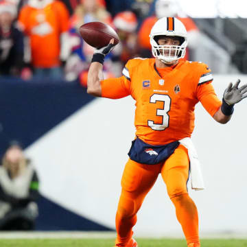 Dec 24, 2023; Denver, Colorado, USA; Denver Broncos quarterback Russell Wilson (3) prepares to pass in the first half against the New England Patriots at Empower Field at Mile High. Mandatory Credit: Ron Chenoy-USA TODAY Sports