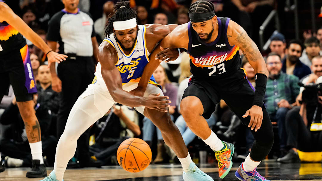 Nov 13, 2025; Phoenix, Arizona, USA;  Indiana Pacers forward Jarace Walker (5) and Phoenix Suns guard Jordan Goodwin (23) dive for the ball during the second half of the game at Mortgage Matchup Center. Mandatory Credit: Arianna Grainey-Imagn Images