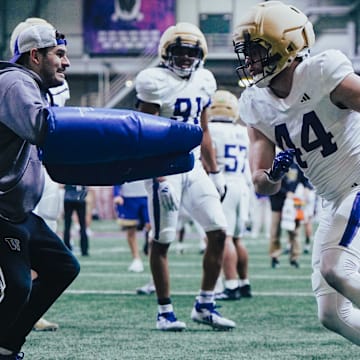 Hayden Moore deals with dummy-holding edge coach Aaron Van Horn.