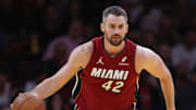 Nov 26, 2024; Miami, Florida, USA; Miami Heat forward Kevin Love (42) dribbles the basketball against the Milwaukee Bucks during the second quarter at Kaseya Center. Mandatory Credit: Sam Navarro-Imagn Images