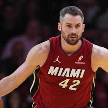 Nov 26, 2024; Miami, Florida, USA; Miami Heat forward Kevin Love (42) dribbles the basketball against the Milwaukee Bucks during the second quarter at Kaseya Center. Mandatory Credit: Sam Navarro-Imagn Images