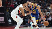 Oct 24, 2025; Portland, Oregon, USA;  Golden State Warriors guard Stephen Curry (30) dribbles the ball past Portland Trail Blazers forward Toumani Camara (33) in the first half at Moda Center. Mandatory Credit: Jaime Valdez-Imagn Images