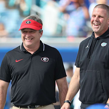 Oct 28, 2023; Jacksonville, Florida, USA; Florida Gators head coach Billy Napier and Georgia Bulldogs head coach Kirby Smart prior to the game at EverBank Stadium. Mandatory Credit: Kim Klement Neitzel-Imagn Images