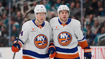 Mar 8, 2025; San Jose, California, USA; New York Islanders defenseman Adam Boqvist (34) celebrates with defenseman Anthony De Angelo (4) after scoring a goal against the San Jose Sharks during the third period at SAP Center at San Jose. Mandatory Credit: Robert Edwards-Imagn Images