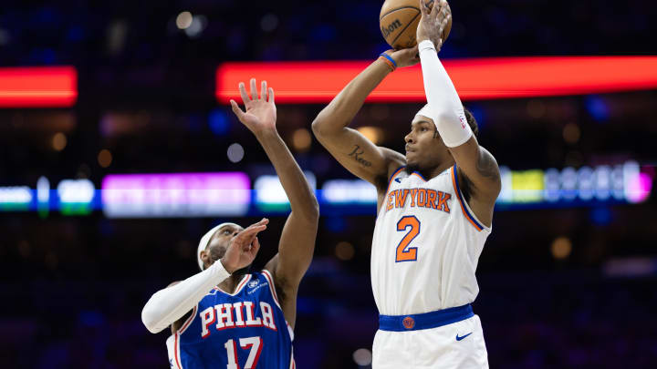 May 2, 2024; Philadelphia, Pennsylvania, USA; New York Knicks guard Miles McBride (2) shoots against Philadelphia 76ers guard Buddy Hield (17) during the first half of game six of the first round for the 2024 NBA playoffs at Wells Fargo Center. Mandatory Credit: Bill Streicher-USA TODAY Sports