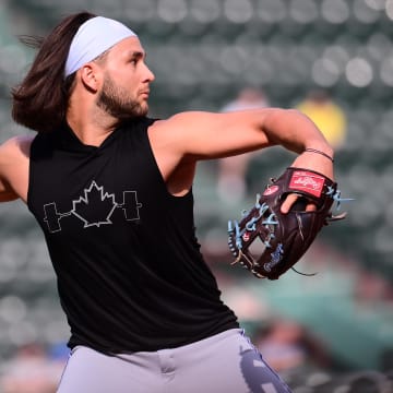 Jun 26, 2024; Boston, Massachusetts, USA; Toronto Blue Jays shortstop Bo Bichette (11) warms up before a game against the Boston Red Sox  at Fenway Park.