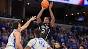 Dec 21, 2024; Memphis, Tennessee, USA; Mississippi State Bulldogs forward KeShawn Murphy (3) shoots the ball as Memphis Tigers forward Nicholas Jourdain (2) defends during the second half at FedExForum. Mandatory Credit: Wesley Hale-Imagn Images