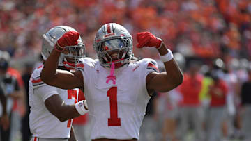 Oct 11, 2025; Champaign, Illinois, USA;  Ohio State Buckeyes wide receiver Phillip Bell (7) and Ohio State Buckeyes wide receiver Brandon Inniss (1) react during the second quarter against the Illinois Fighting Illini at Memorial Stadium. Mandatory Credit: Ron Johnson-Imagn Images
