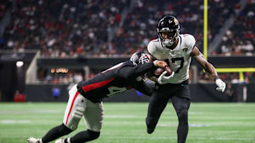 Aug 23, 2024; Atlanta, Georgia, USA; Jacksonville Jaguars tight end Evan Engram (17) is pushed out of bounds by Atlanta Falcons linebacker Bradlee Anae (47) in the second quarter at Mercedes-Benz Stadium.