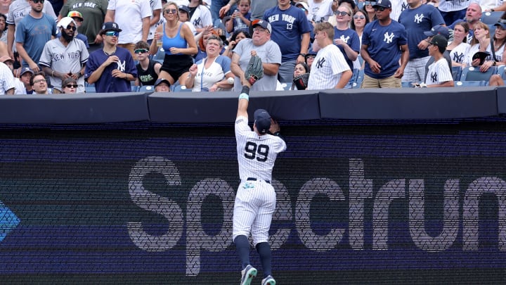 Jul 20, 2024; Bronx, New York, USA; New York Yankees right fielder Aaron Judge (99) leaps but can't catch a three run home run by Tampa Bay Rays catcher Alex Jackson (not pictured) during the fourth inning at Yankee Stadium.