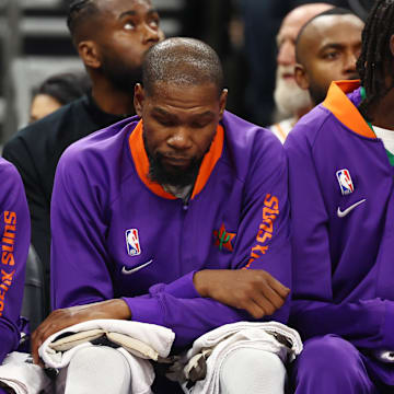 Dec 19, 2024; Phoenix, Arizona, USA; Phoenix Suns guard Bradley Beal (left) and forward Kevin Durant react on the bench against the Indiana Pacers at Footprint Center. Mandatory Credit: Mark J. Rebilas-Imagn Images