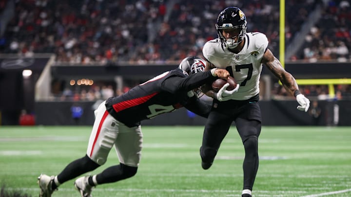 Aug 23, 2024; Atlanta, Georgia, USA; Jacksonville Jaguars tight end Evan Engram (17) is pushed out of bounds by Atlanta Falcons linebacker Bradlee Anae (47) in the second quarter at Mercedes-Benz Stadium. Mandatory Credit: Brett Davis-Imagn Images