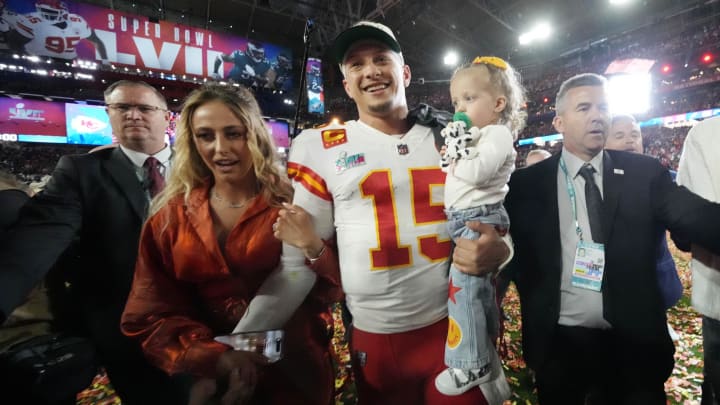 Feb 12, 2023; Glendale, AZ, USA; Kansas City Chiefs quarterback Patrick Mahomes (15) walks off the field with his wife Brittany and daughter Sterling after defeating the Philadelphia Eagles in Super Bowl LVII at State Farm Stadium. Mandatory Credit: Michael Chow/The Republic via USA TODAY Sports