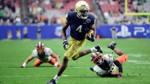 Jan, 2022; Notre Dame Fighting Irish wide receiver Kevin Austin Jr. (4) scores a touchdown against the Oklahoma State Cowboys