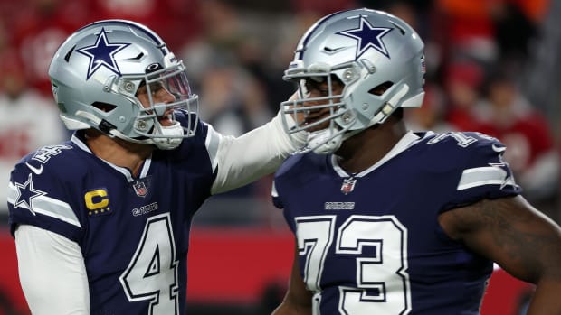 quarterback Dak Prescott (4) reacts with Dallas Cowboys offensive tackle Tyler Smith 