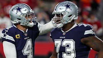 Dallas Cowboys star Dak Prescott reacts with offensive tackle Tyler Smith before a game against the Tampa Bay Buccaneers.