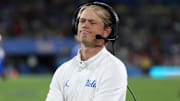 Sep 12, 2025; Pasadena, California, USA;  UCLA Bruins assistant head coach Jerry Neuheisel looks on during the second half against the New Mexico Lobos at Rose Bowl. Mandatory Credit: Kiyoshi Mio-Imagn Images