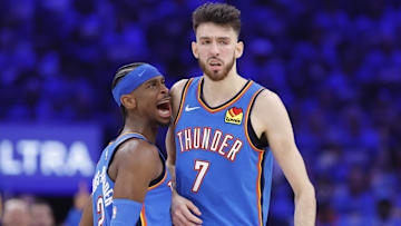 May 22, 2025; Oklahoma City, Oklahoma, USA; Oklahoma City Thunder guard Shai Gilgeous-Alexander (2) and forward Chet Holmgren (7) celebrate after a play against the Minnesota Timberwolves in the third quarter during game two of the western conference finals for the 2025 NBA Playoffs at Paycom Center. Mandatory Credit: Alonzo Adams-Imagn Images