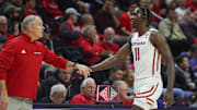 Dec 23, 2022; Piscataway, New Jersey, USA; Rutgers Scarlet Knights head coach Steve Pikiell greets center Clifford Omoruyi (11) after being subbed out during the second half against the Bucknell Bison at Jersey Mike's Arena. Mandatory Credit: Vincent Carchietta-Imagn Images