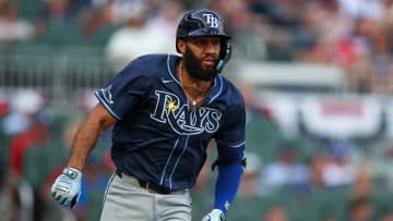 Jun 14, 2024; Atlanta, Georgia, USA; Tampa Bay Rays third baseman Amed Rosario (10) hits a RBI double against the Atlanta Braves in the first inning at Truist Park. Mandatory Credit: Brett Davis-USA TODAY Sports