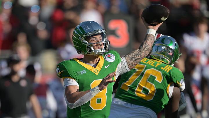 Jan 1, 2025; Pasadena, CA, USA; Oregon Ducks quarterback Dillon Gabriel (8) throws a pass in the first quarter against the Ohio State Buckeyes in the 2025 Rose Bowl college football quarterfinal game at Rose Bowl Stadium.