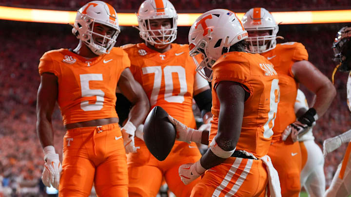 Tennessee running back Dylan Sampson (6) celebrates in the end zone with wide receiver Bru McCoy (5), offensive linemen Andrej Karic (70), and Cooper Mays (63) during the NCAA college football game against Kent State on Saturday, Sept. 15, 2024 in Knoxville, Tenn.